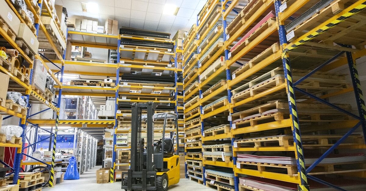 Warehouse operator scanning inventory with a handheld device